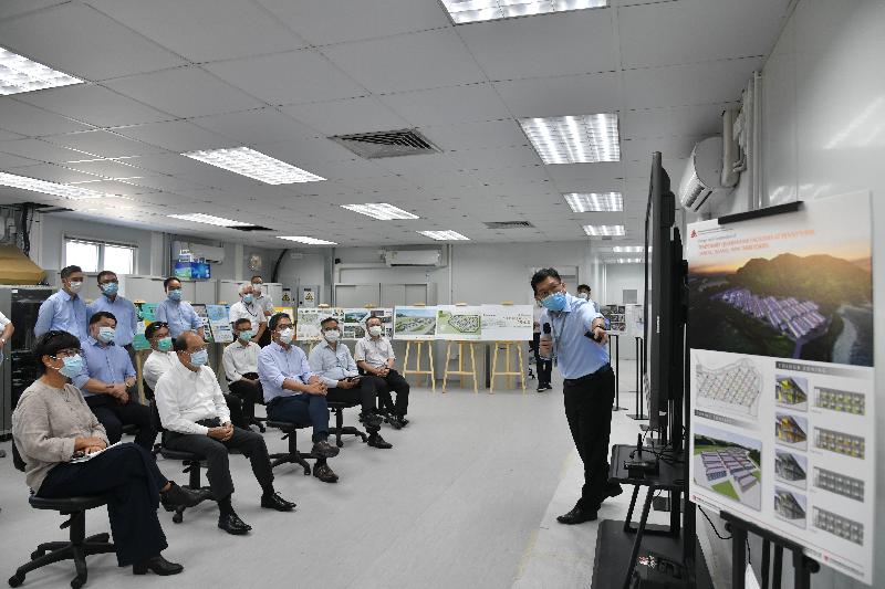 The Chief Secretary for Administration, Mr Matthew Cheung Kin-chung, today (July 13) visited Penny's Bay to inspect the construction progress of new quarantine facilities. Photo shows Mr Cheung (front row, second left), accompanied by the Secretary for Development, Mr Michael Wong (front row, third left); the Director of Architectural Services, Mrs Sylvia Lam (front row, first left); and the Director of Civil Engineering and Development, Mr Ricky Lau (front row, second right), receiving a briefing from a Civil Engineering and Development Department staff member on the development process of the new quarantine facilities.