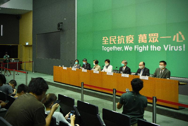 The Chief Executive, Mrs Carrie Lam (centre), holds a press conference on measures to fight the epidemic with the Secretary for Labour and Welfare, Dr Law Chi-kwong (third right); the Secretary for Transport and Housing, Mr Frank Chan Fan (second right); the Secretary for Food and Health, Professor Sophia Chan (third left); the Secretary for Home Affairs, Mr Caspar Tsui (first right); the Permanent Secretary for Food and Health (Health), Mr Thomas Chan (second left); and the Director of Health, Dr Constance Chan (first left), at the Central Government Offices, Tamar, this evening (July 13).