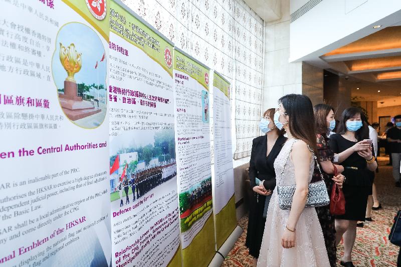 The Hong Kong Economic and Trade Office in Wuhan today (July 17) held the Reception for the 23rd Anniversary of the Establishment of the Hong Kong Special Administrative Region in Wuhan, Hubei Province. Photo shows guests visiting the exhibition on the Basic Law.