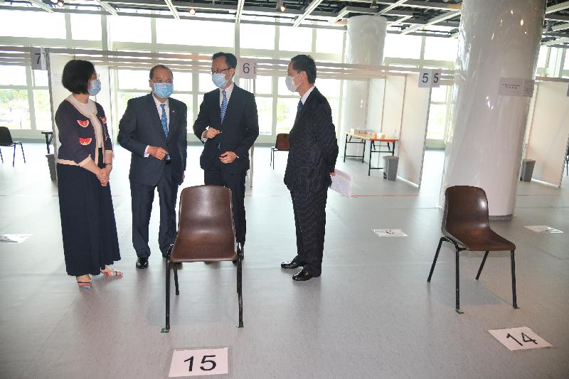 The Chief Secretary for Administration, Mr Matthew Cheung Kin-chung, today (August 31) visited the Community Testing Centre at Hong Kong City Hall. Photo shows Mr Cheung (second left), accompanied by the Secretary for the Civil Service, Mr Patrick Nip (second right), and the Secretary for Food and Health, Professor Sophia Chan (first left), being briefed on the design and workflow of the testing centre. Mr Cheung was pleased to learn that the entire workflow design was formulated in accordance with the social distancing principle.