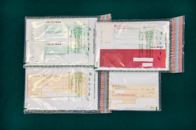 Hong Kong Customs mounted an operation codenamed "Shadow Hunter" in September and successfully smashed a large-scale money laundering syndicate involving a family of five and a local money changer. The amount involved in the case was over $3 billion, which is the largest ever among similar cases handled by Customs. Photo shows some of the signed cheque books involved in the case.