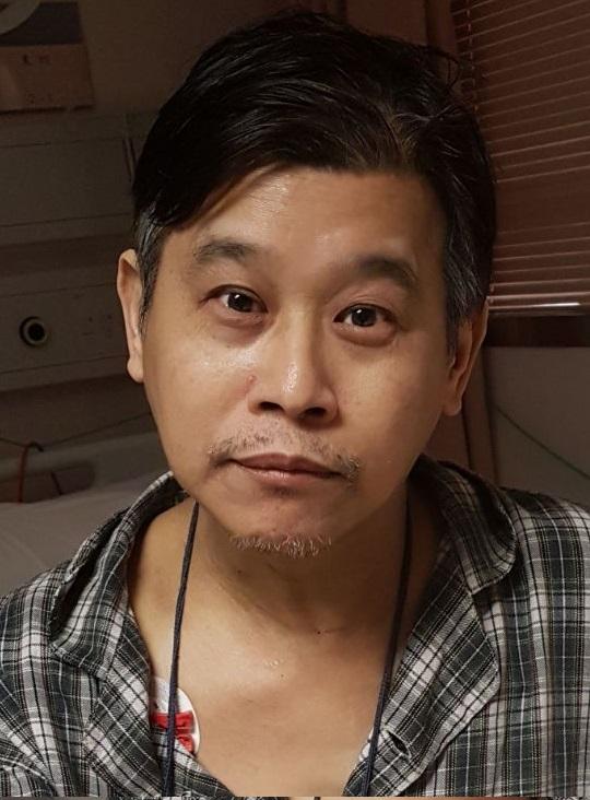Lam Hoi, aged 58, is about 1.65 metres tall, 70 kilograms in weight and of medium build. He has a long face with yellow complexion and short black hair. 