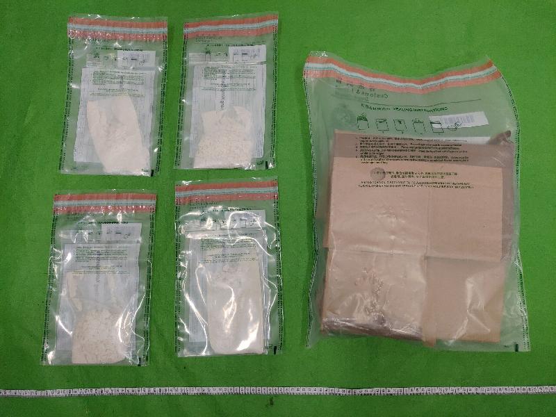 Hong Kong Customs seized about 400 grams of suspected cocaine with an estimated market value of about $580,000 at Hong Kong International Airport on September 18. Photo shows the suspected cocaine seized and the carton used to conceal the dangerous drugs.