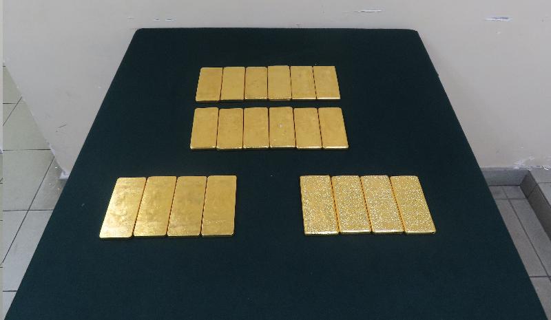 Hong Kong Customs mounted a special operation codenamed "Melter" last month to fight against cross-boundary precious metal smuggling activities and related suspected money laundering activities. Six gold smuggling cases using cross-boundary goods vehicles were detected at Lok Ma Chau Control Point and Man Kam To Control Point. Suspected smuggled gold weighing about 71 kilograms with an estimated market value of about $35 million was seized and six cross-boundary goods vehicle drivers were arrested. Photo shows some of the suspected smuggled gold seized.