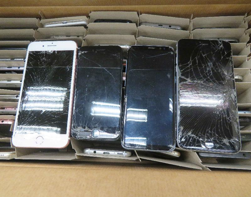 Four of the illegally imported waste mobile phone displays intercepted by the Environmental Protection Department at Hong Kong International Airport in May this year.