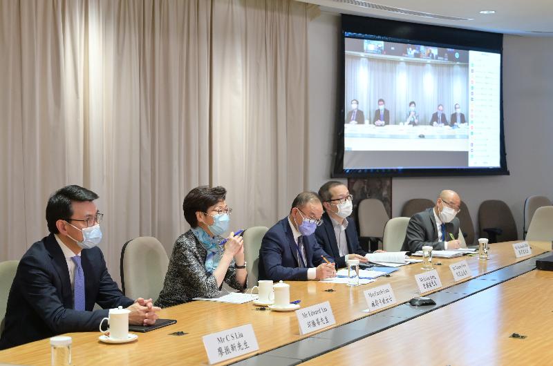 The Chief Executive, Mrs Carrie Lam (second left), held a meeting via video conferencing with representatives of major chambers of commerce and some professional bodies in the afternoon today (October 30). The Secretary for Commerce and Economic Development, Mr Edward Yau (first left) and the Secretary for Constitutional and Mainland Affairs, Mr Erick Tsang (third left) were also present.