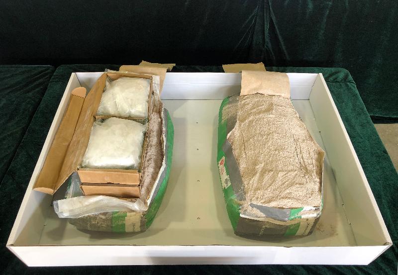 Hong Kong Customs made a record seizure of suspected methamphetamine (commonly known as "ice") following the discovery of over 500 kilograms of the drug with an estimated market value of nearly $300 million concealed in cement in a container at the Tsing Yi Customs Cargo Examination Compound on October 29. Picture shows some of the suspected "ice" (left) and cement seized.
