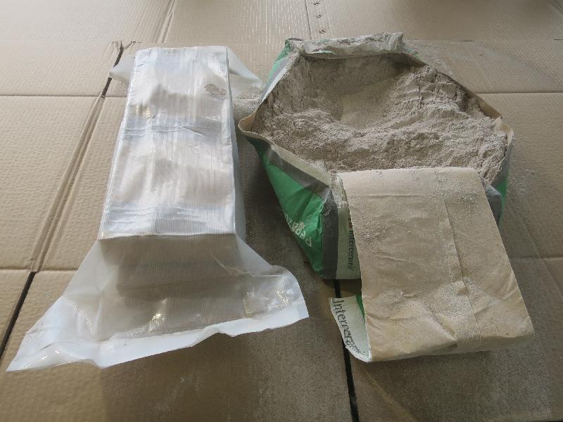 Hong Kong Customs made a record seizure of suspected methamphetamine (commonly known as "ice") following the discovery of over 500 kilograms of the drug with an estimated market value of nearly $300 million concealed in cement in a container at the Tsing Yi Customs Cargo Examination Compound on October 29. Picture shows cement (right) and vacuum-packed cartons in which suspected "ice" was hidden.