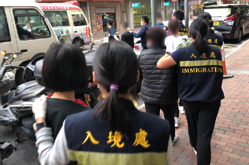 The Immigration Department mounted an anti-illegal worker operation in Kowloon codenamed "Twilight" today (November 3). Photo shows suspected illegal workers arrested during the operation.