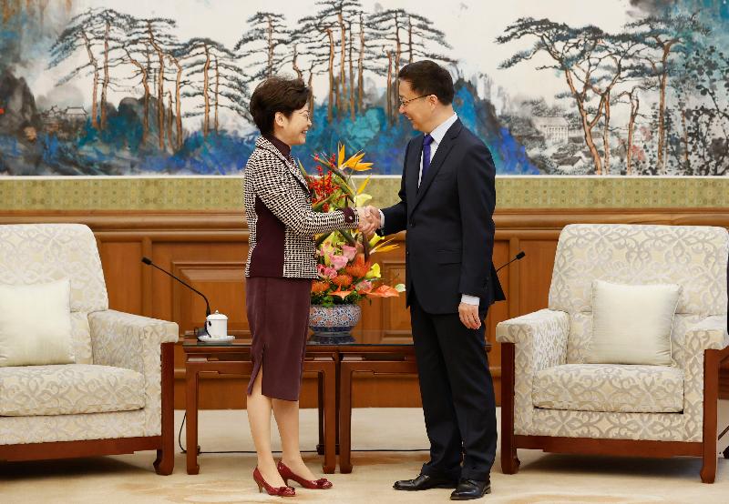 The Chief Executive, Mrs Carrie Lam (left), is received by the Vice Premier of the State Council, Mr Han Zheng (right), in Beijing this morning (November 6).