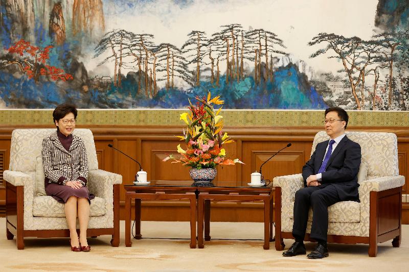 The Chief Executive, Mrs Carrie Lam (left), is received by the Vice Premier of the State Council, Mr Han Zheng (right), in Beijing this morning (November 6). 