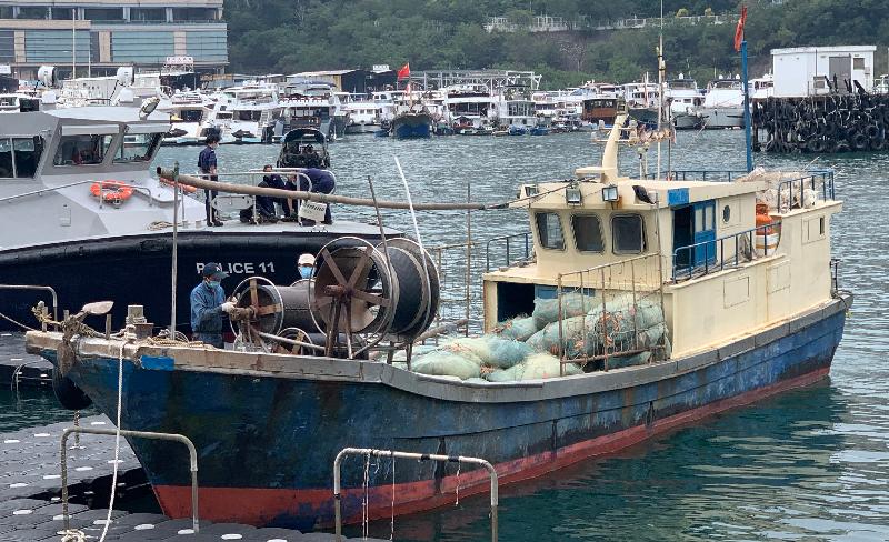 Agriculture, Fisheries and Conservation Department officers today (November 10) charged four men on board a Mainland vessel suspected of engaging in illegal fishing in the southern waters of Lamma Island in Hong Kong. Photo shows the Mainland vessel.
