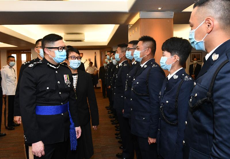The Commissioner of Police, Mr Tang Ping-keung (first left), congratulates the probationary inspectors after the passing-out parade at the Hong Kong Police College today (November 21).
