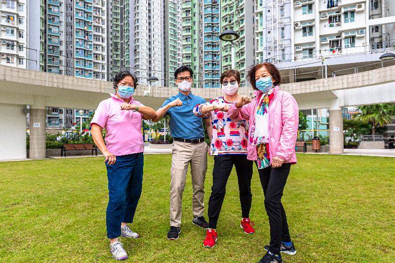 The Hong Kong Housing Authority has produced a series of videos, "Fitness Exercise for the Elderly", featuring a set of simple exercises specially designed for its elderly tenants so that they can practise at home conveniently through visual learning. Photo shows Deputy Director of Housing (Estate Management), Mr Ricky Yeung (second left), elbow shaked with elderly tenants to say "Hi" on the filming day.