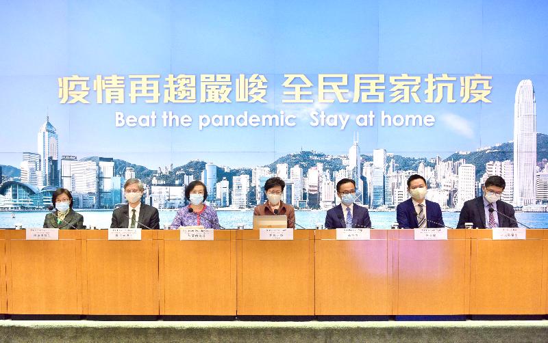 The Chief Executive, Mrs Carrie Lam (centre), holds a press conference on measures to fight the disease with the Secretary for Labour and Welfare, Dr Law Chi-kwong (second left); the Secretary for Food and Health, Professor Sophia Chan (third left); the Secretary for the Civil Service, Mr Patrick Nip (third right); the Secretary for Home Affairs, Mr Caspar Tsui (second right); the Director of Health, Dr Constance Chan (first left); and the Chief Executive of the Hospital Authority, Dr Tony Ko (first right), at the Central Government Offices, Tamar, this afternoon (December 11).