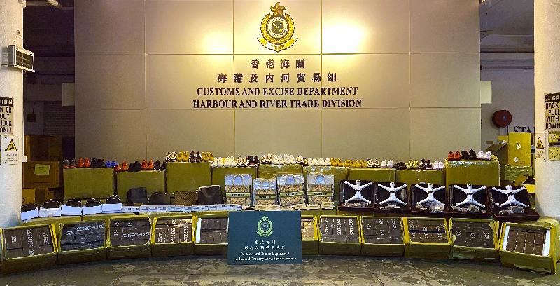 Hong Kong Customs seized about 63 000 items of suspected counterfeit and smuggled goods with an estimated market value of about $5.7 million at the Tuen Mun River Trade Terminal on December 18. Photo shows the suspected counterfeit and smuggled goods seized.