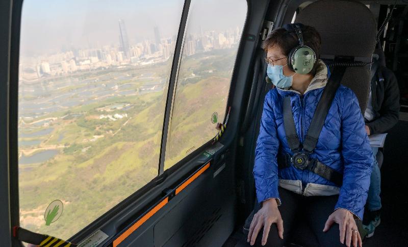The Chief Executive, Mrs Carrie Lam today (December 27), accompanied by the Secretary for Security, Mr John Lee and the Secretary for Development, Mr Michael Wong, visited the headquarters of the Government Flying Service, and took a helicopter tour to view sites related to various development plans she proposed in the 2020 Policy Address. Picture shows Mrs Lam taking the helicopter tour.