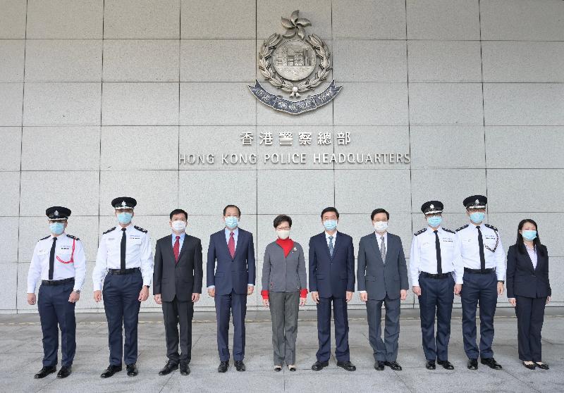 The Chief Executive, Mrs Carrie Lam (fifth left), visited the Hong Kong Police Force this afternoon (January 31) to learn more about its recent situation and met with the police officers who were injured earlier while handling illegal violent incidents to give them her regards. Photo shows Mrs Lam; the Director of the Liaison Office of the Central People's Government in the Hong Kong Special Administrative Region (CPGLO), Mr Luo Huining (fifth right); the Deputy Director of the CPGLO, Mr Yang Jianping (fourth left); the Director-General of the Police Liaison Department of the CPGLO, Mr Chen Feng (third left); the Secretary for Security, Mr John Lee (fourth right);  the Commissioner of Police, Mr Tang Ping-keung (third right) and other senior officials of the Police Force at the Police Headquarters in Wan Chai.
