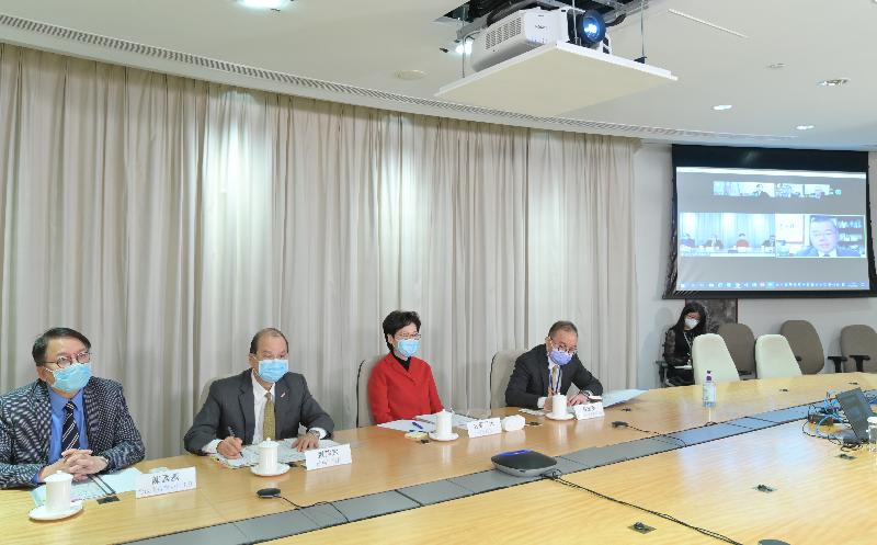 The Chief Executive, Mrs Carrie Lam (third left), holds an online engagement session with Hong Kong deputies to the National People's Congress via video conferencing today (February 8).