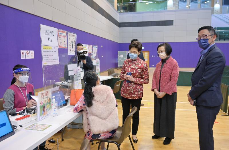 The Chief Executive, Mrs Carrie Lam (third right), accompanied by the Secretary for Food and Health, Professor Sophia Chan (second right), visits the community testing centre at Ma On Shan Sports Centre today (February 12).