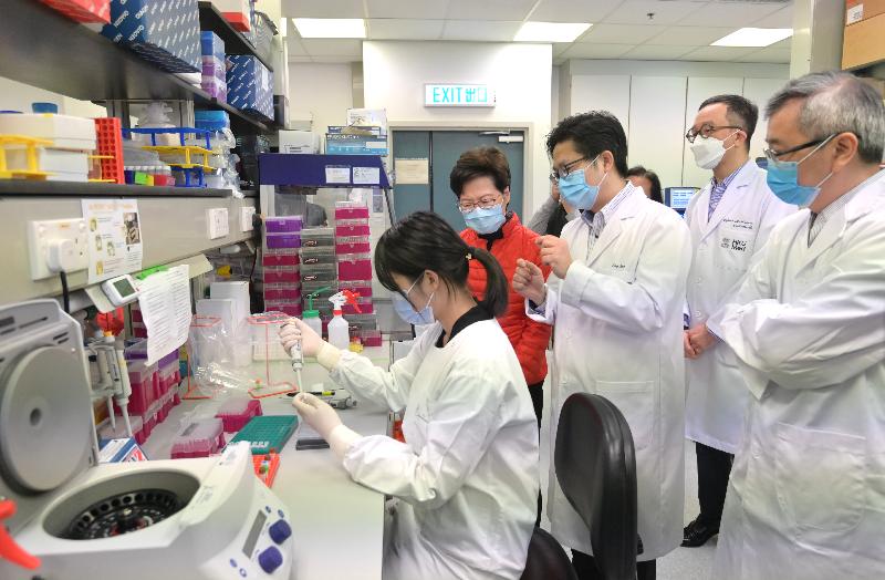 The Chief Executive, Mrs Carrie Lam, this morning (February 15) visited the public health laboratory of the University of Hong Kong (HKU). Photo shows Mrs Lam (second left) receiving a briefing on the virus inactivation, pre-treatment process of sewage samples and final procedure for sewage tests for SARS-CoV-2 virus. Looking on are Professor Gabriel Leung (second right), the Dean of Li Ka Shing Faculty of Medicine of HKU, and Professor Zhang Tong (first right) of Environmental Microbiome Engineering and Biotechnology Laboratory of the Department of Civil Engineering of HKU.