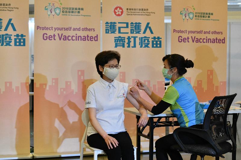 The Chief Executive, Mrs Carrie Lam (left), receives COVID-19 vaccination today (February 22) at the Community Vaccination Centre at the Hong Kong Central Library Exhibition Gallery.