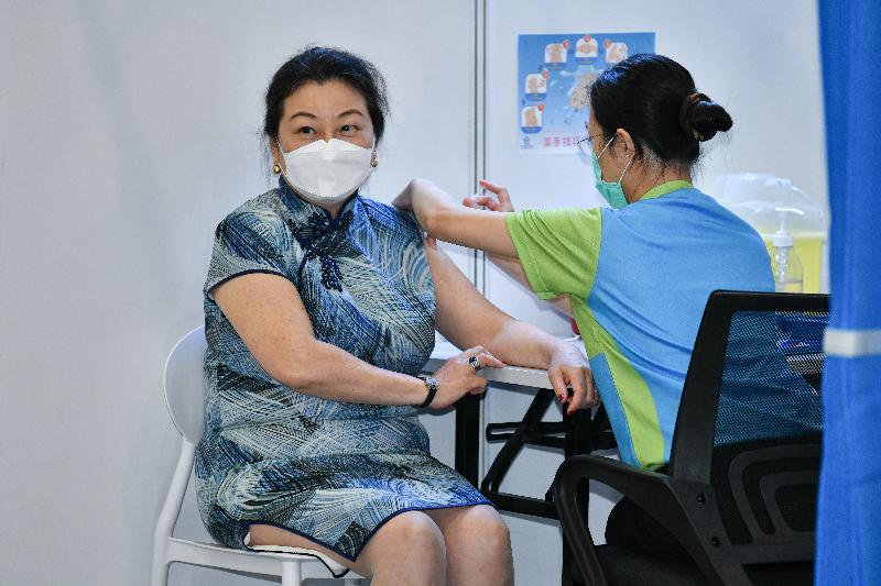 The Secretary for Justice, Ms Teresa Cheng, SC (left), receives COVID-19 vaccination today (February 22) at the Community Vaccination Centre at the Hong Kong Central Library Exhibition Gallery.