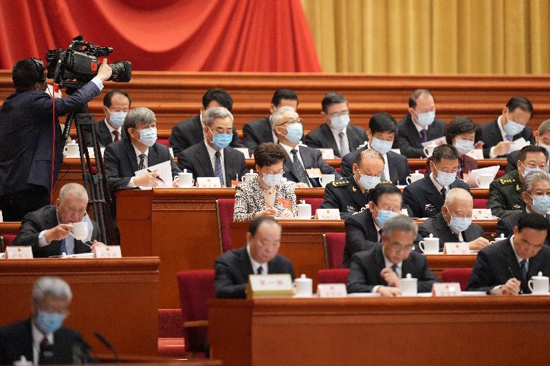 The Chief Executive, Mrs Carrie Lam (third row, fourth right), attends the opening ceremony of the fourth session of the 13th National People's Congress in Beijing this morning (March 5).