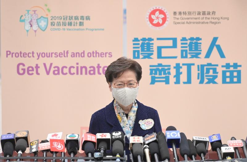 The Chief Executive, Mrs Carrie Lam, together with a number of Secretaries of Departments and Directors of Bureaux, received the second COVID-19 vaccination dose at the Conference Hall, Central Government Offices, Tamar, this morning (March 22). Photo shows Mrs Lam meeting the media after receiving the vaccine.