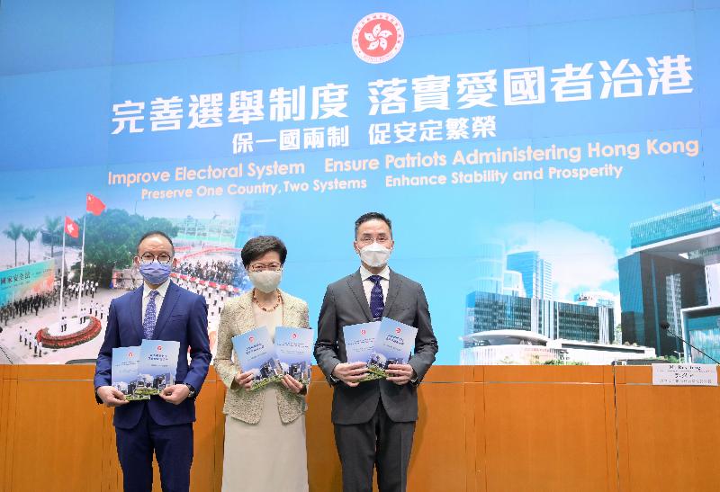 The Chief Executive, Mrs Carrie Lam (centre), together with the Secretary for Constitutional and Mainland Affairs, Mr Erick Tsang Kwok-wai (left), and the Permanent Secretary for Constitutional and Mainland Affairs, Mr Roy Tang (right), meet the media at the Central Government Offices, Tamar, today (March 30).