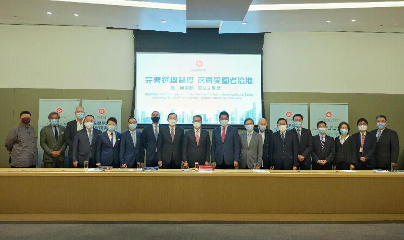 The Financial Secretary, Mr Paul Chan, today (April 1) met with representatives from the business and accounting sectors to explain the amendments to Annex I to the Basic Law on Method for the Selection of the Chief Executive of the Hong Kong Special Administrative Region (HKSAR) and Annex II to the Basic Law on Method for the Formation of the Legislative Council of the Hong Kong Special Administrative Region and its Voting Procedures approved by the Standing Committee of the National People's Congress in regard to the Decision of the National People's Congress on improving the electoral system of the HKSAR. Photo shows Mr Chan (ninth left) pictured with representatives of the Hong Kong General Chamber of Commerce.
