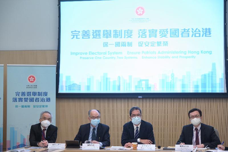 The Secretary for Development, Mr Michael Wong (second right), and the Secretary for Transport and Housing, Mr Frank Chan Fan (third right), hosted a total of six briefing sessions today (April 7) to brief the construction and transport sectors as well as members of related professional institutions on the background, objectives and details of the improvements to the electoral system, and exchange views with participants.