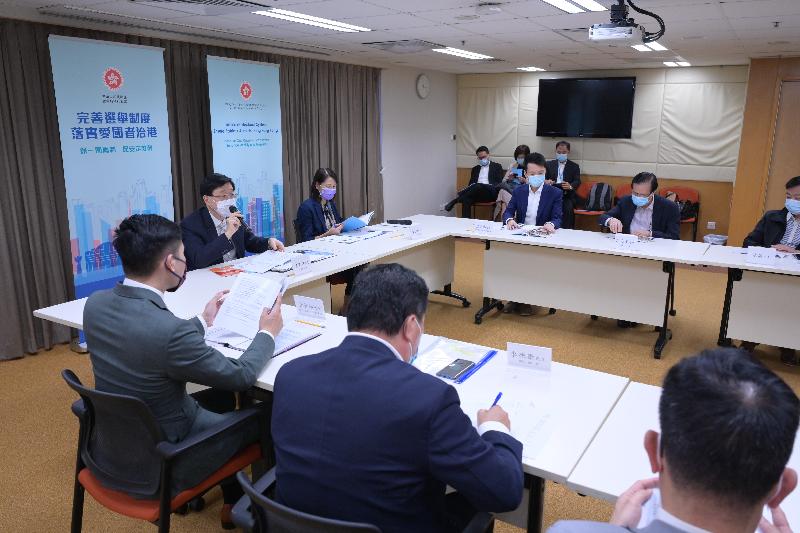 The Secretary for Security, Mr John Lee (rear, first left), today (April 8) briefed the representatives of District Fight Crime Committees, District Fire Safety Committees and Area Committees of Yuen Long District, Yau Tsim Mong District and Wong Tai Sin District on the background and objectives of improving Hong Kong Special Administrative Region's electoral system. The Permanent Secretary for Security, Ms Carol Yip (rear, second left), also attended.