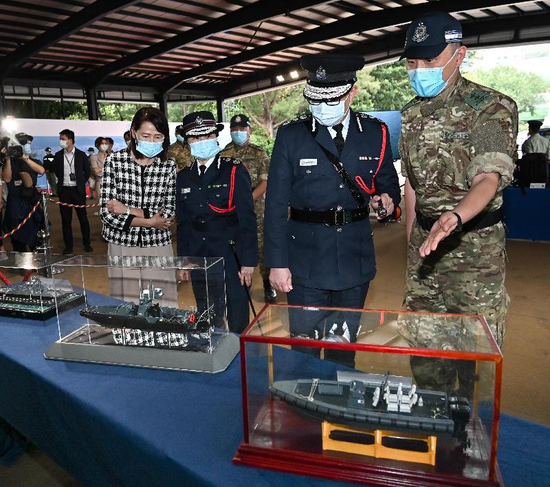 The Police Force held an open day in support of the National Security Education Day at Hong Kong Police College today (April 15). Photo shows (from the left) the Permanent Secretary for Security, Ms Carol Yip; the Deputy Commissioner of Police (National Security), Ms Lau Chi-wai; and the Commissioner of Police, Mr Tang Ping-keung, touring a display of equipment of Small Boat Division, Marine Police.
