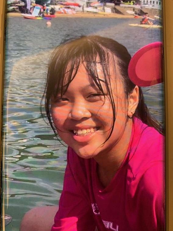 Lam Hoi-ying, aged 14, is about 1.58 metres tall, 55 kilograms in weight and of medium build. She has a round face with yellow complexion and long black hair. She was last seen wearing a light-coloured jacket, a black shirt, black shorts, black shoes and carrying a black handbag.