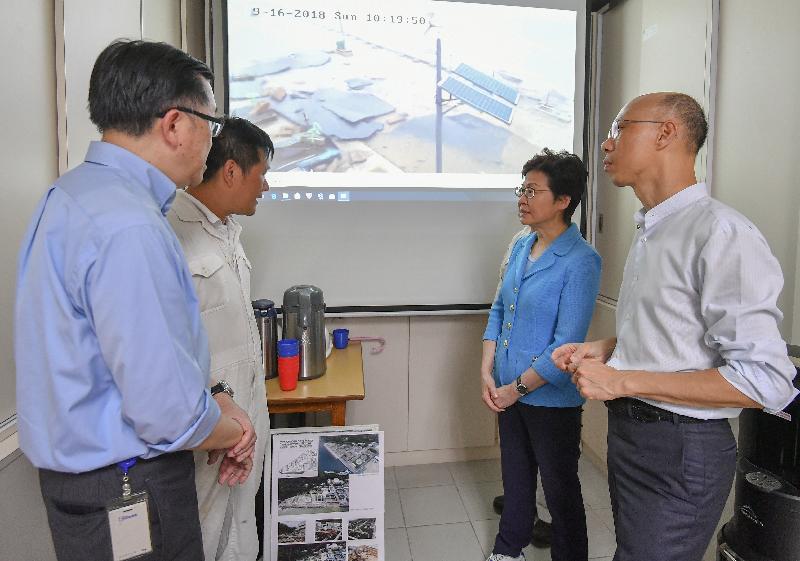 The Chief Executive, Mrs Carrie Lam (second right), this afternoon  (September 24) inspects the Sai Kung Sewage Treatment Works which were seriously damaged by the typhoon, and meets staff of the Drainage Services Department who were on duty during the typhoon.  Looking on are Secretary for Environment, Mr Wong Kam-sing (first right), and the Director of Drainage Services, Mr Edwin Tong (first left).