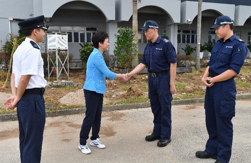 The Chief Executive, Mrs Carrie Lam (second left), this afternoon (September 24) inspects the Marine Police East Division operational base, and meets with Senior Police Inspector Thomas Chum (second right), who bravely rescued members of the public from the sea during the typhoon.