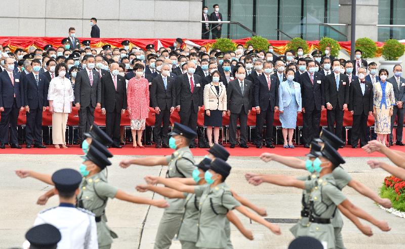 The Chief Executive, Mrs Carrie Lam(front row,sixth left), and her husband Dr Lam Siu-por(front row,seventh left);the Chief Justice of the Court of Final Appeal, Mr Geoffrey Ma Tao-li(front row,eighth left) and his wife, Madam Justice Maria Candace Yuen(front row,ninth left);Vice-Chairman of the National Committee of the Chinese People's Political Consultative Conference (CPPCC) Mr Tung Chee Hwa(front row,fifth left);Vice-Chairman of the National Committee of the CPPCC Mr C Y Leung(front row,fourth left) and his wife, Mrs Regina Leung(front row,third left);former Chief Executive Mr Donald Tsang(front row,second right) and his wife, Mrs Selina Tsang(front row,first right);the Director of the Liaison Office of the Central People's Government (CPG) in the Hong Kong Special Administrative Region (HKSAR), Mr Luo Huining(front row,second left);the head of the Office for Safeguarding National Security of the CPG in the HKSAR, Mr Zheng Yanxiong(front row,first left);the Chief Secretary for Administration, Mr Matthew Cheung Kin-chung (front row,seventh right);the Financial Secretary, Mr Paul Chan(front row,sixth right);the Secretary for Justice, Ms Teresa Cheng, SC(front row,fifth right);the President of the Legislative Council, Mr Andrew Leung(front row,fourth right);the Convenor of the Non-official Members of the Executive Council, Mr Bernard Chan(front row,third right), together with Principal Officials and guests, attend the flag-raising ceremony for the 71st anniversary of the founding of the People's Republic of China at Golden Bauhinia Square in Wan Chai today (October 1).