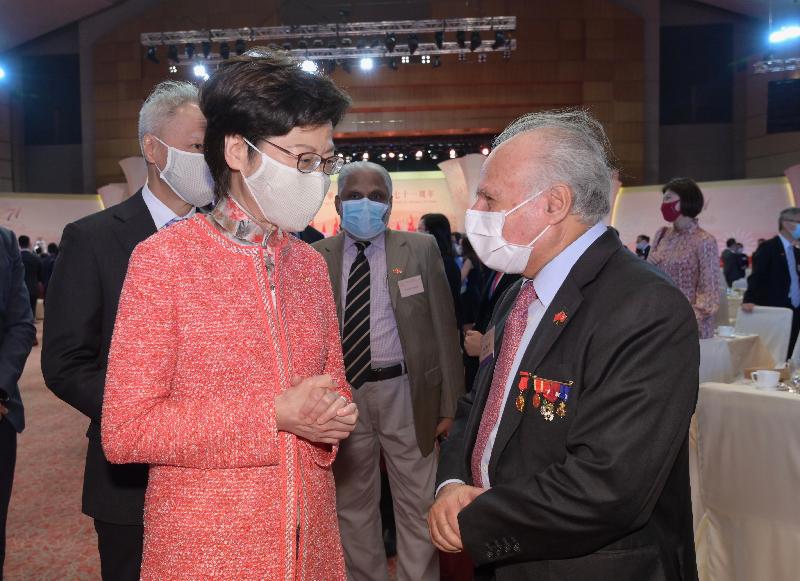 The Chief Executive, Mrs Carrie Lam, together with Principal Officials and guests, attended the reception for the 71st anniversary of the founding of the People's Republic of China at the Hong Kong Convention and Exhibition Centre this morning (October 1). Photo shows Mrs Lam (first left) chatting with guests.