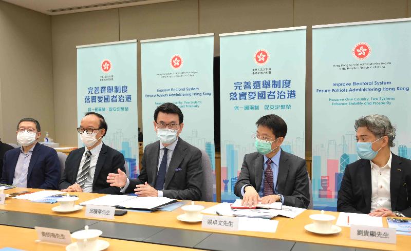 The Secretary for Commerce and Economic Development, Mr Edward Yau (centre), briefs representatives from sectors including broadcasting, film, music and performing arts on the improvements to the electoral system of Hong Kong today (April 13).