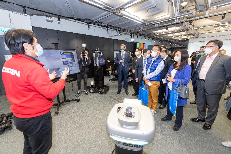 The Legislative Council (LegCo) Panel on Information Technology and Broadcasting visited Cyberport today (May 4). Photo shows LegCo Members touring an alumni company of the Cyberport Incubation Programme to learn about the latest developments of robotics products and solutions.