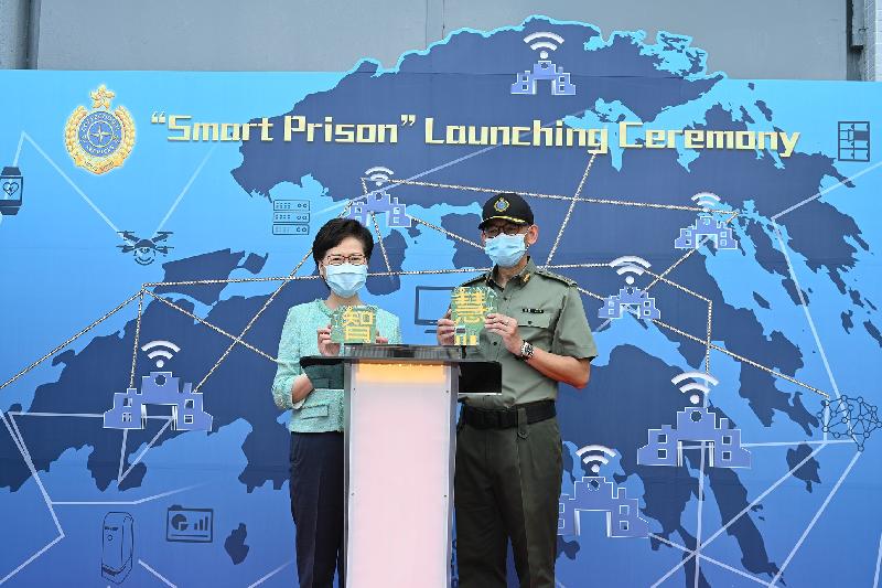 The Chief Executive, Mrs Carrie Lam, officiated at the "Smart Prison" launching ceremony at Tai Tam Gap Correctional Institution of the Correctional Services Department today (May 22). Photo shows Mrs Lam (left), accompanied by the Commissioner of Correctional Services, Mr Woo Ying-ming (right), officiating at the ceremony.
