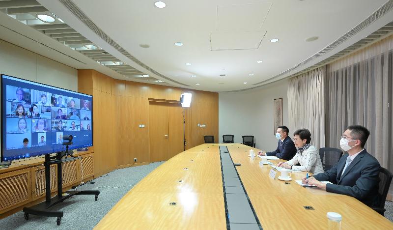 The Chief Executive, Mrs Carrie Lam (centre), tonight (June 7) met with representatives of Mainland and overseas art galleries at a webinar to brief them on Hong Kong's competitive edge as an international arts and cultural hub. The Secretary for Home Affairs, Mr Caspar Tsui (left), and the Under Secretary for Commerce and Economic Development, Dr Bernard Chan (right), also attended.