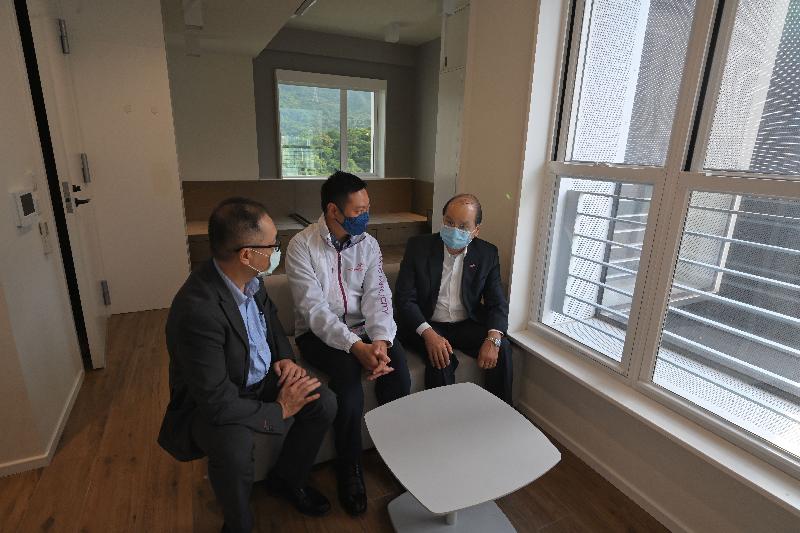 The Chief Secretary for Administration, Mr Matthew Cheung Kin-chung, visited the Hong Kong Federation of Youth Groups (HKFYG) youth hostel, PH2, in Tai Po today (June 8). Photo shows Mr Cheung (right), accompanied by the Secretary for Home Affairs, Mr Caspar Tsui (centre), receiving a briefing on the hostel's operations from the Executive Director of the HKFYG, Mr Andy Ho (left).