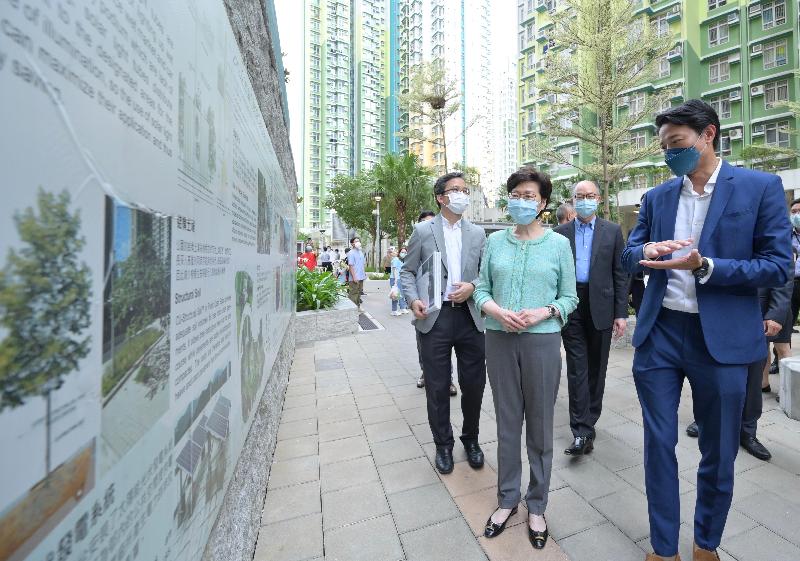 The Chief Executive, Mrs Carrie Lam (second left), today (June 10), accompanied by the Secretary for Transport and Housing, Mr Frank Chan Fan (third left), visited On Tai Estate at On Sau Road, Kwun Tong, which was located in a site which was formerly the Anderson Road Quarry. Photo shows Mrs Lam being briefed by a staff member of the Housing Department on the exhibition panels next to the Geo-heritage Plaza  at On Tai Estate.