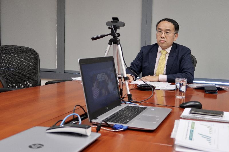 The Secretary for Financial Services and the Treasury, Mr Christopher Hui, speaks at the webinar co-organised by the Hong Kong Economic and Trade Office in Singapore and Invest Hong Kong for the Indian business community today (June 15).