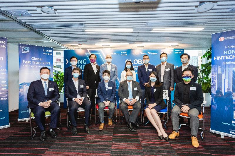 Invest Hong Kong (InvestHK) announced today (June 17) that the Global Fast Track 2021 programme is now open for applications. Photo shows (front row, from left) the Head of Investment of the Hong Kong Science and Technology Parks Corporation, Mr Raymond Wong; Head of Innovation and Data Lab of the Hong Kong Exchanges and Clearing Limited Mr Lukas Petrikas; the Chief Fintech Officer of the Hong Kong Monetary Authority, Mr Nelson Chow; the Director-General of Investment Promotion at InvestHK, Mr Stephen Phillips; the Senior Manager, Fintech Unit, Intermediaries of the Securities and Futures Commission, Ms Angela Wong; the Senior Manager, FinTech Cluster at Cyberport, Mr Rico Tang; the Head of Fintech at InvestHK, Mr King Leung (back row, second left); and representatives from the business sector that support the programme at the Global Fast Track 2021 press conference.