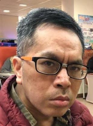 Ho Tak-kuen, Jimmy, aged 61, is about 1.65 metres tall, 61 kilograms in weight and of medium build. He has a round face with yellow complexion and short black hair. There are moles on his nose. He was last seen wearing a pair of black-rimmed glasses, a red sleeveless vest jacket, black T-shirt, brown pants and white sports shoes. 