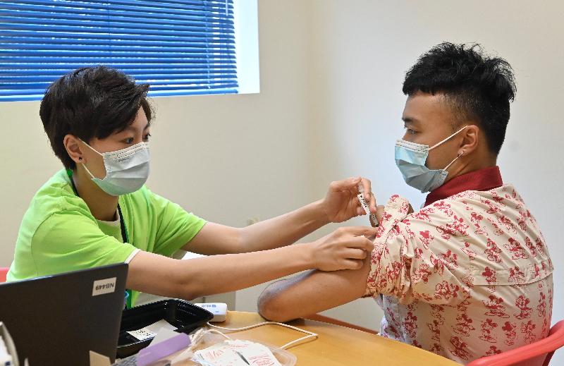 The Secretary for the Civil Service, Mr Patrick Nip, visited Hong Kong Disneyland today (July 5) to view the administering of a COVID-19 vaccine to staff members of the theme park as arranged by the Government's outreach vaccination service. Photo shows a staff member receiving his COVID-19 vaccination.