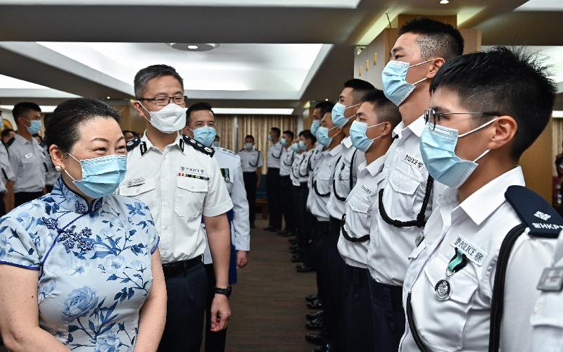 The Secretary for Justice, Ms Teresa Cheng, SC (first left), and the Commissioner of Police, Mr Siu Chak-yee (second left) congratulates the probationary inspectors after the passing-out parade held at the Hong Kong Police College today (July 10).